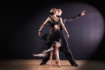 Fototapeta premium dancers in ballroom isolated on black background