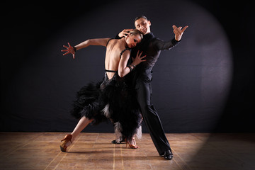 dancers in ballroom isolated on black background