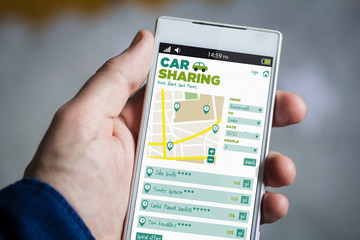 holding car sharing smartphone