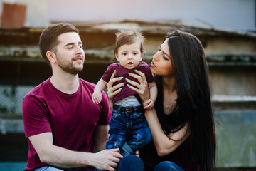 young family with a child on the nature