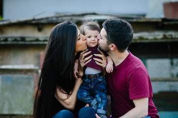 young family with a child on the nature