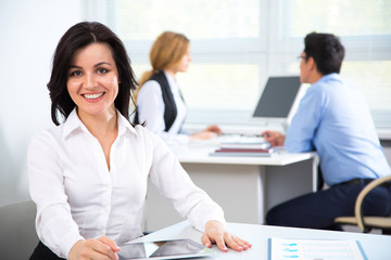 Fototapeta premium Businesswoman with colleagues