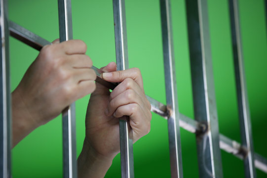hand of prisoner in jail