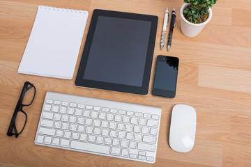 Top view office table with mobile phone