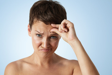 woman with a wrinkles on a forehead