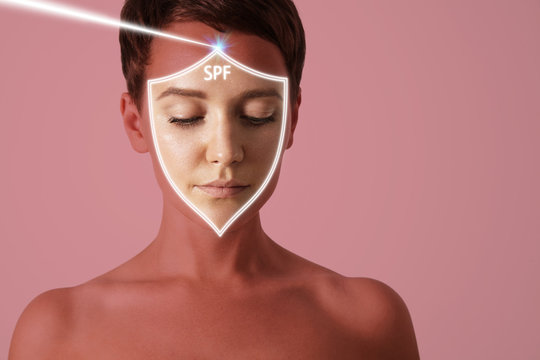 pretty woman's face incide spf shield protected her from the sun