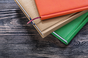 Notepads on vintage wooden board education concept