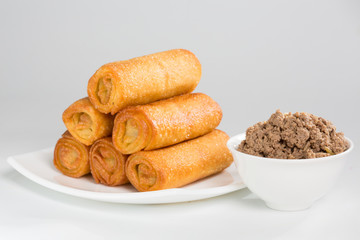 pancakes with meat on white plate