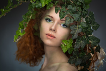 girl wearing a wreath of ivy leaves