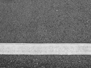 Fototapeta premium closeup new white line on the road texture