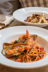 Mussel in tomato sauce spaghetti in cafe.