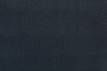 Fototapeta na wymiar Dark blue background from a textile material. Fabric with natural texture. Backdrop.