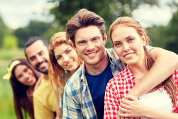 group of smiling friends outdoors