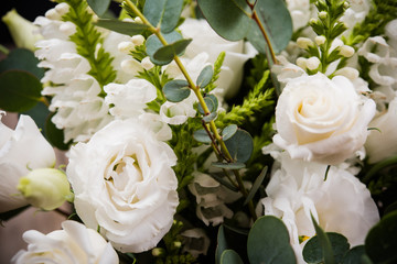Elegant white bouquet of flowers and leaves macro closeup
