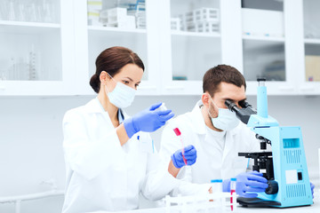 young scientists making test or research in lab