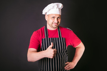 Naklejka premium Portrait of a cook man in the studio