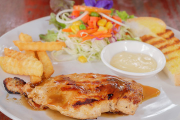 Chicken steak in dish.