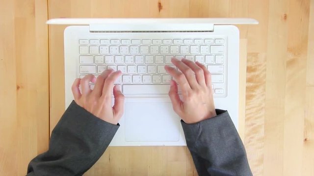 Top View Woman Hands Typing On Laptop Keyboard.