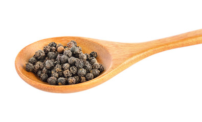 peppercorn in wood spoon