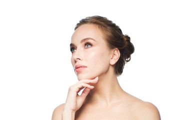 beautiful young woman touching her face