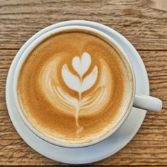 tree art cappuccino coffee on grunge wooden table