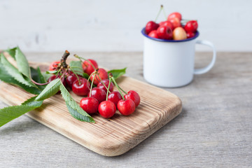Freshly picked cherries on the table close up, selective focus