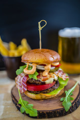 Tasty street food grilled beef burger in crispy shortbread with lettuce and mayonnaise 