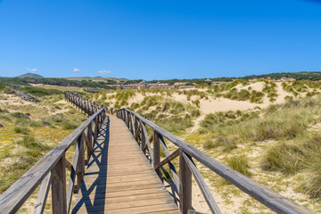Fototapeta na wymiar Foot bridge at Cala Mesquida - beautiful coast of island Mallorca, Spain