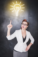 Idea concept. Woman showing on drawing lamp