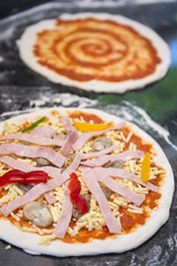 Chef preparing pizza for baking