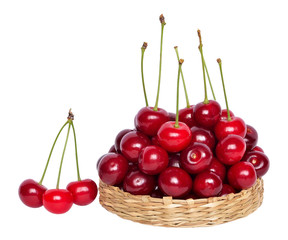 Cherry in the wicker basket isolated on white background