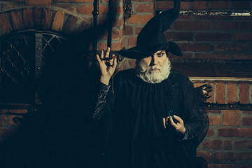 Old wizard with pendulum