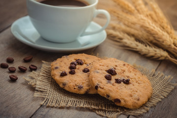 Chocolate chip cookies and coffee cup