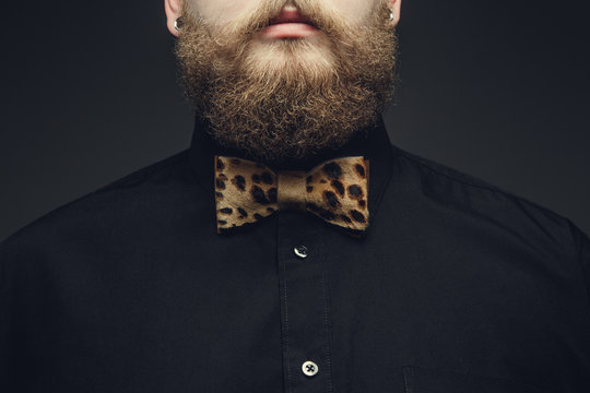 Cropped portrait of bearded male.