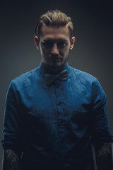 Portrait of modern male in blue shirt.