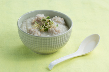 porridge rice gruel in bowl with pork