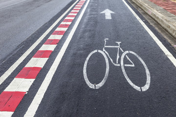 Fototapeta premium Wet Bicycle lane on the side of a highway in Thailand