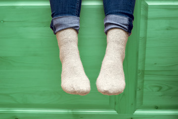 female legs in woolen socks