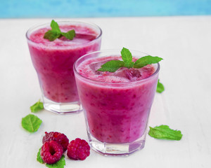 Fresh summer raspberry smoothies with mint leaves
