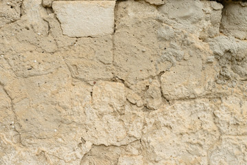 Wall fragment with scratches and cracks