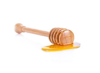 Carving wooden honey dipper spoon isolated on white background c