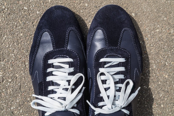 Running shoes on his feet