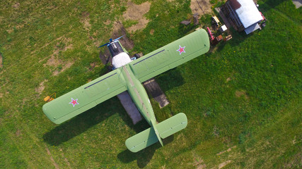 old  aircraft green color with red stars on the wings aerial view