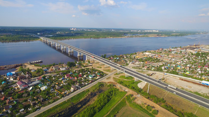bridge over  river in provincial green town aerial view