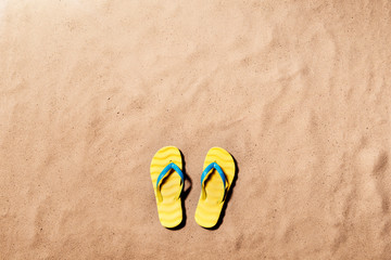 Summer vacation background with a pair of flip flop sandals.