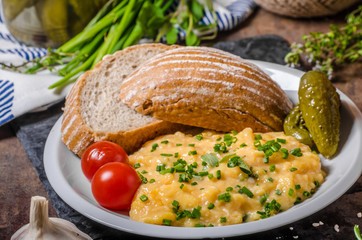 Scrambled eggs in a frying pan