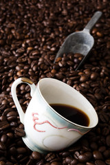 Coffee cup and coffee beans background

