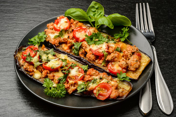 Delicious appetizer -grilled eggplants baked with minced meat, tomatoes and cheese.