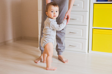 First steps of cute baby boy