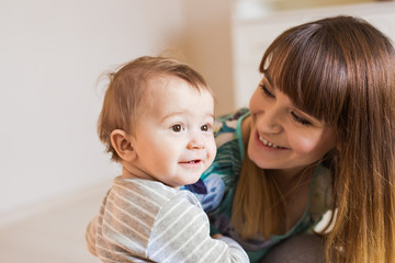 mother playing with baby
